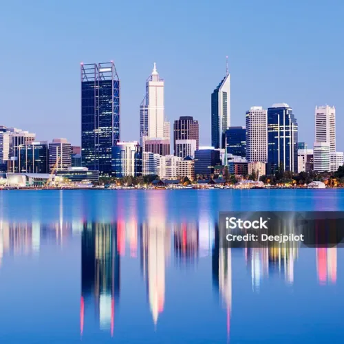 The Perth city skyline at twilight with reflection, viewed across the Swan River, Western Australia.